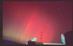 Red aurora over Buildings